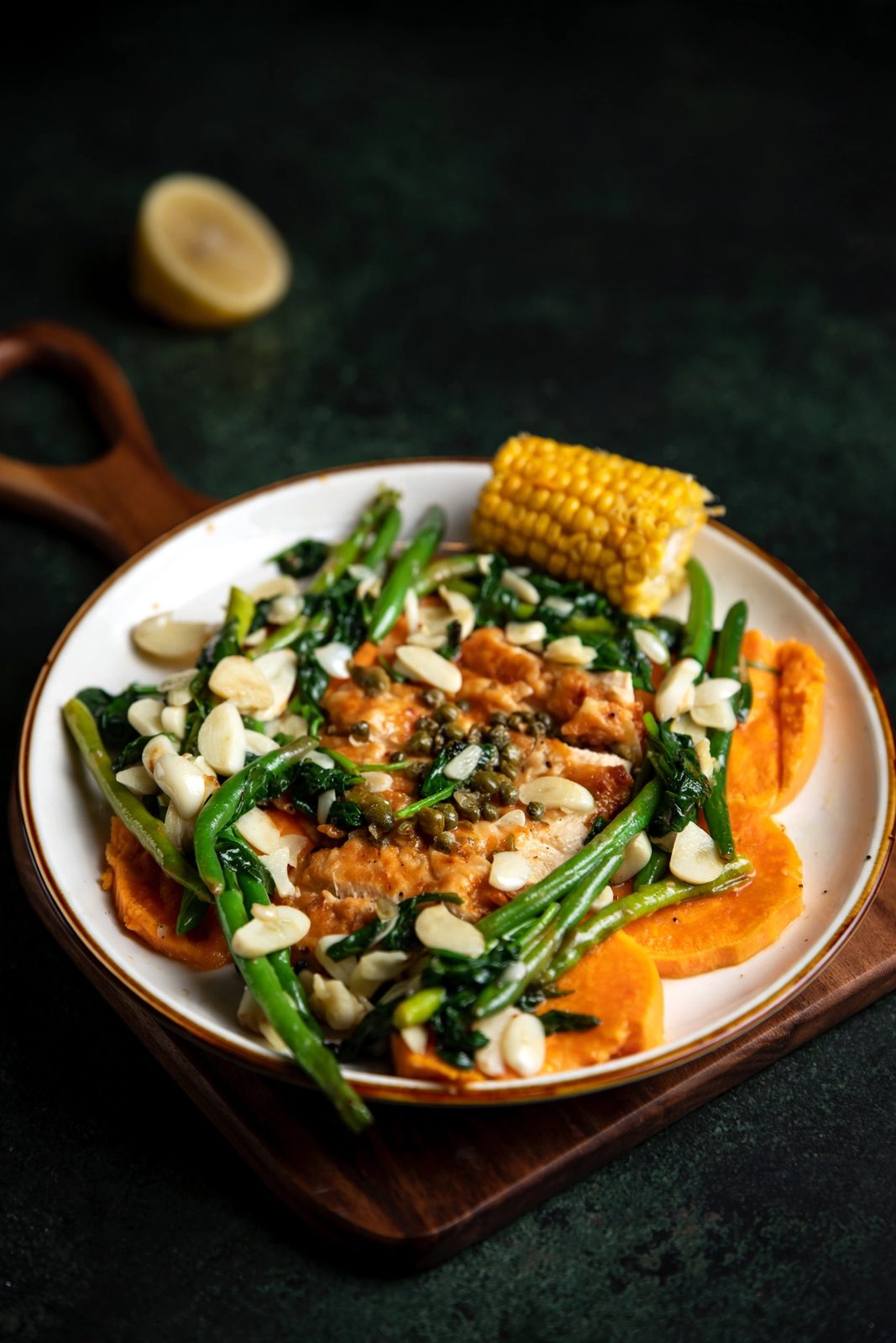 Lemon chicken with greens, almonds and sweet potato